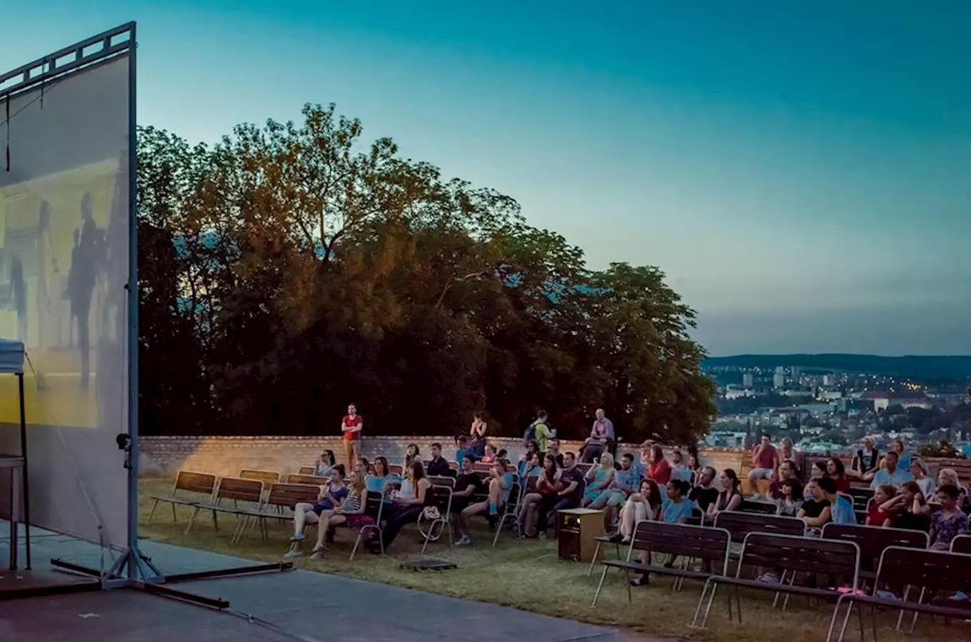 Outdoor cinema audience at dusk