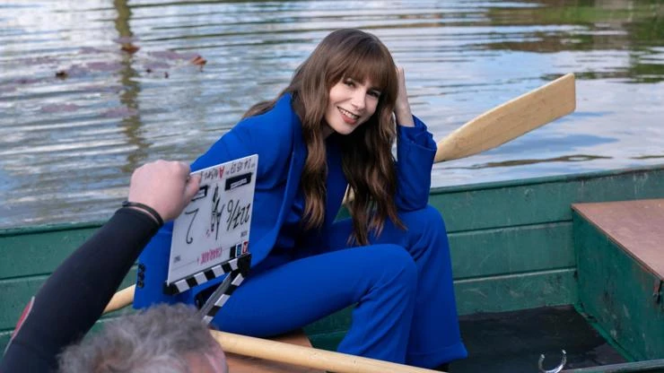 Lily collins in a boat