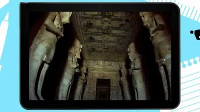 Vnitřek staroegyptského chrámu s obřími sochami a hieroglyfy.