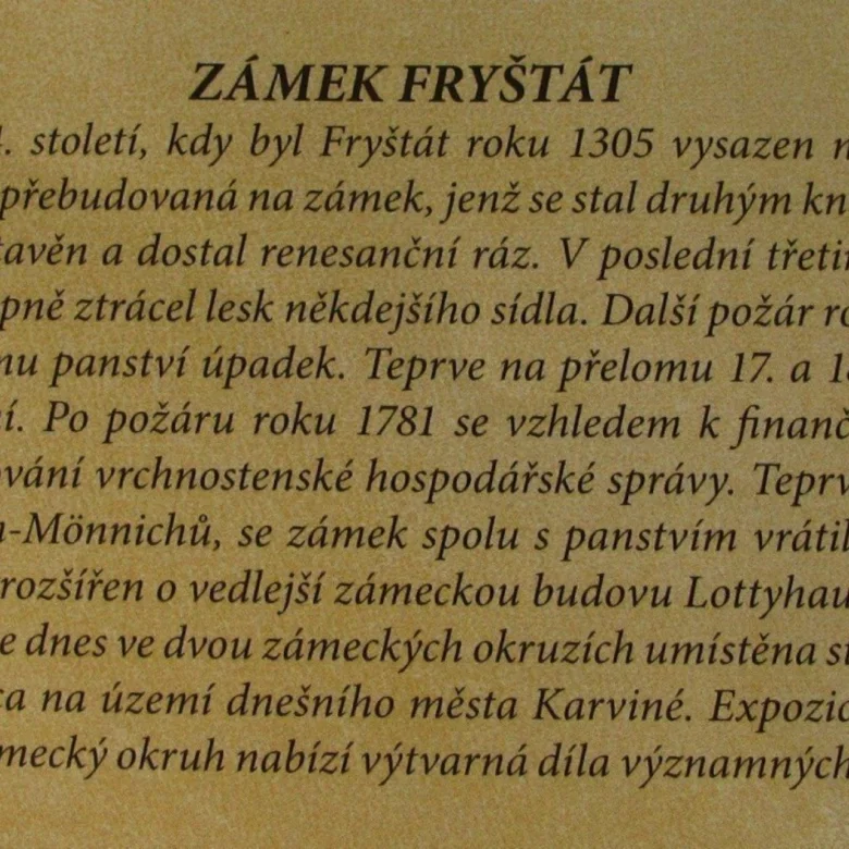 Informační tabule o historii zámku Fryštát v Karviné.