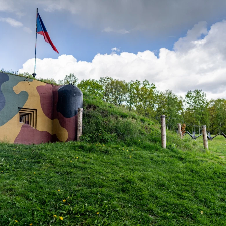 Camouflaged bunker with flag
