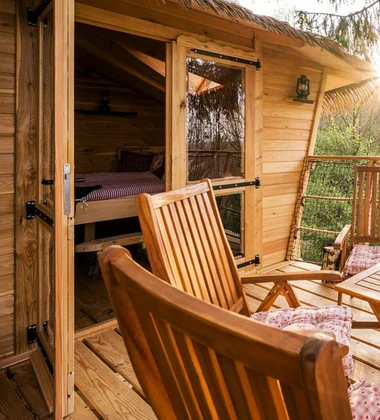 Wooden cabin porch with chairs