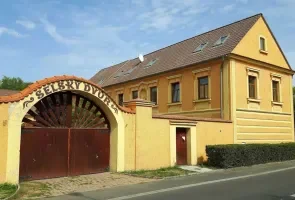 Historic yellow building with archway