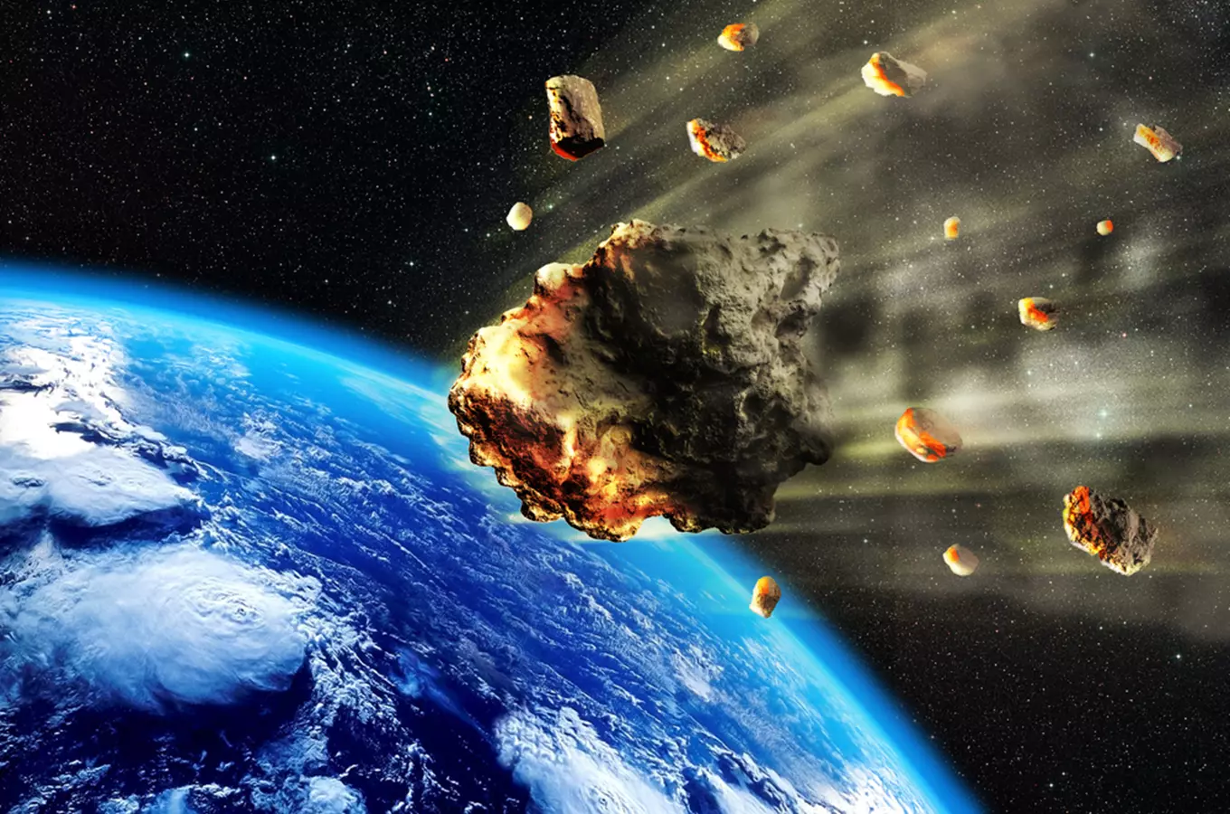 Velký meteorit s menšími úlomky vstupuje do atmosféry Země.