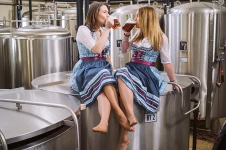 Women drinking beer in brewery